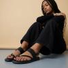 image:imageCUSHIONAIRE Leader Womens Strappy Sandal  Premium Faux Leather Toe Loop Flat with Adjustable Ankle Strap amp Cushioned FootbedBlack