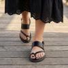 image:imageCUSHIONAIRE Leader Womens Strappy Sandal  Premium Faux Leather Toe Loop Flat with Adjustable Ankle Strap amp Cushioned FootbedBlack