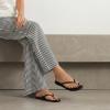 image:imageCUSHIONAIRE Cruise Lightweight Womens Flip Flops Comfortable Beach Sandals for Women with Cushioned Footbed amp Flexible Slip On DesignBlack Smooth