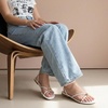 image:imageCUSHIONAIRE Tory Strappy Flat Sandals for Women Toe Ring Sandals with Adjustable Buckle Ankle Strap Wrap StyleIvory