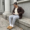 image:imageCUSHIONAIRE Casey Genuine Suede Moccasin Slippers for Women Cozy House Shoes with Moc Toe and Penny Loafer StrapCamel
