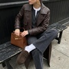 image:imageCUSHIONAIRE Casey Genuine Suede Moccasin Slippers for Women Cozy House Shoes with Moc Toe and Penny Loafer StrapChocolate